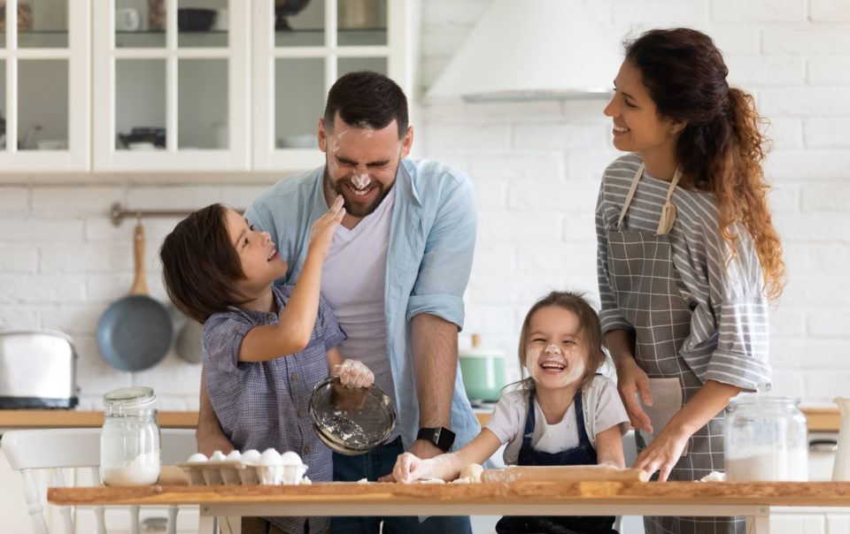 A family having fun in the kitchen