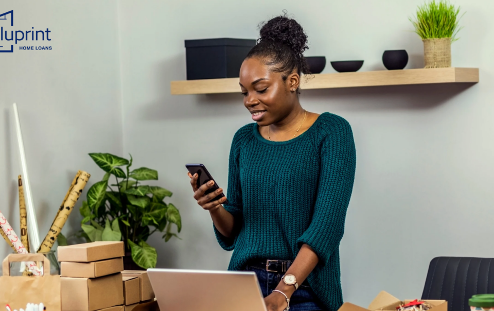 woman on phone with computer in office
